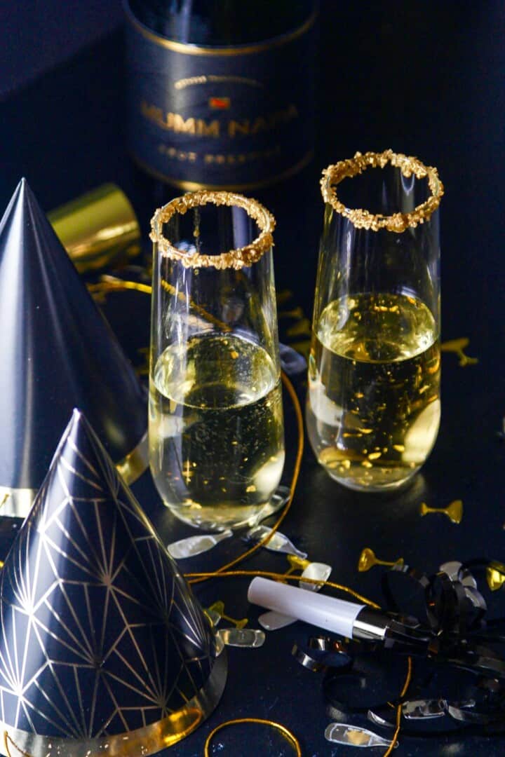 A New Years Eve party with champagne cocktails made with Goldschlager gold liquor.