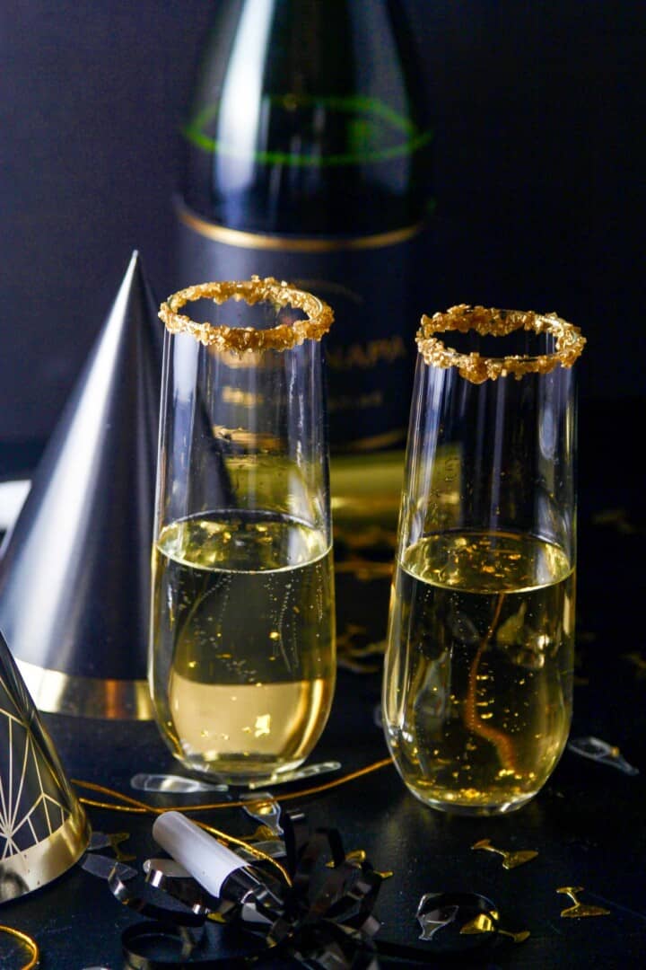 A New Years Eve party with champagne cocktails made with Goldschlager gold liquor.