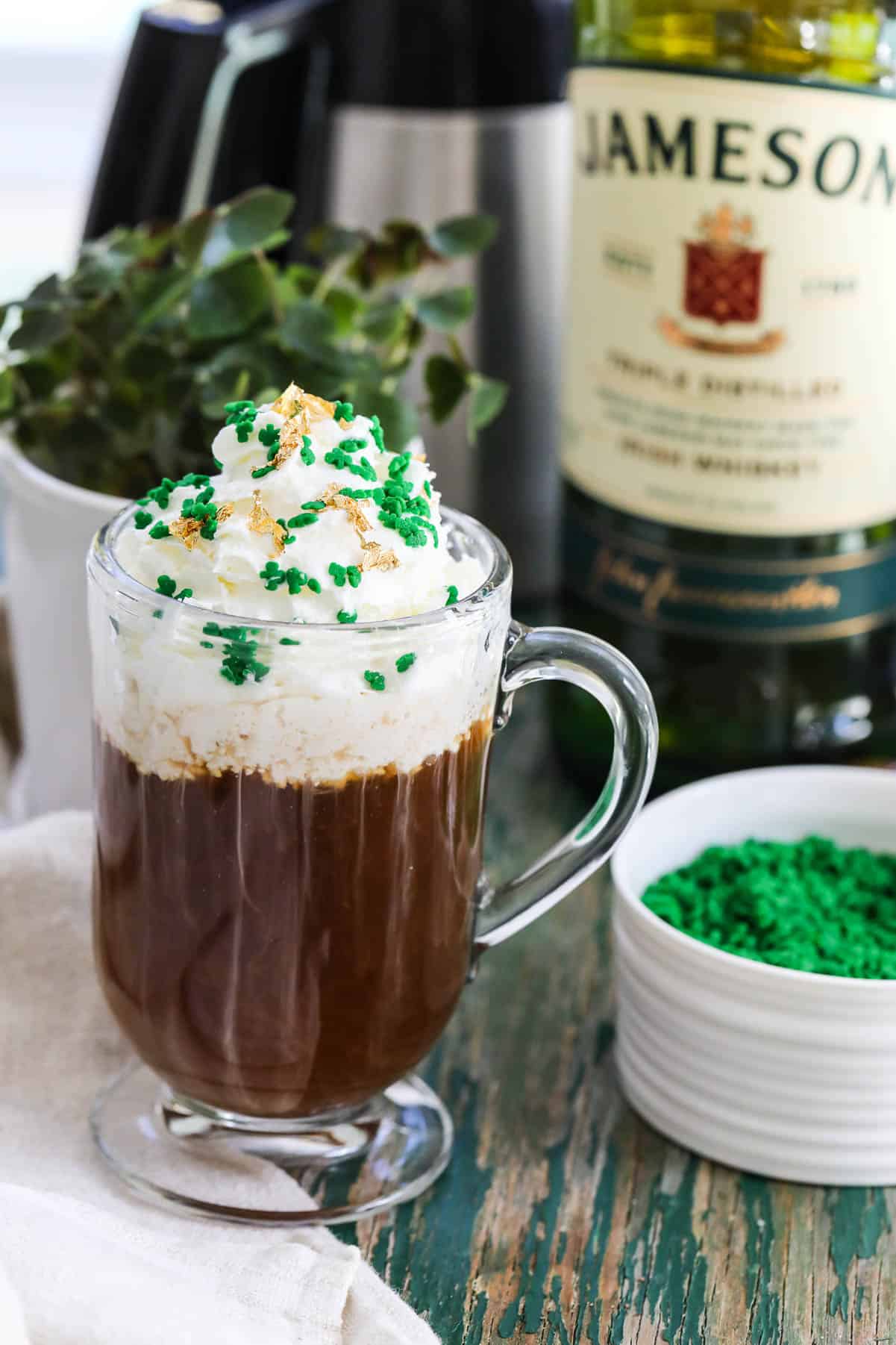 https://www.delicioustable.com/wp-content/uploads/2021/03/Irish-Coffee-with-bottle.jpg