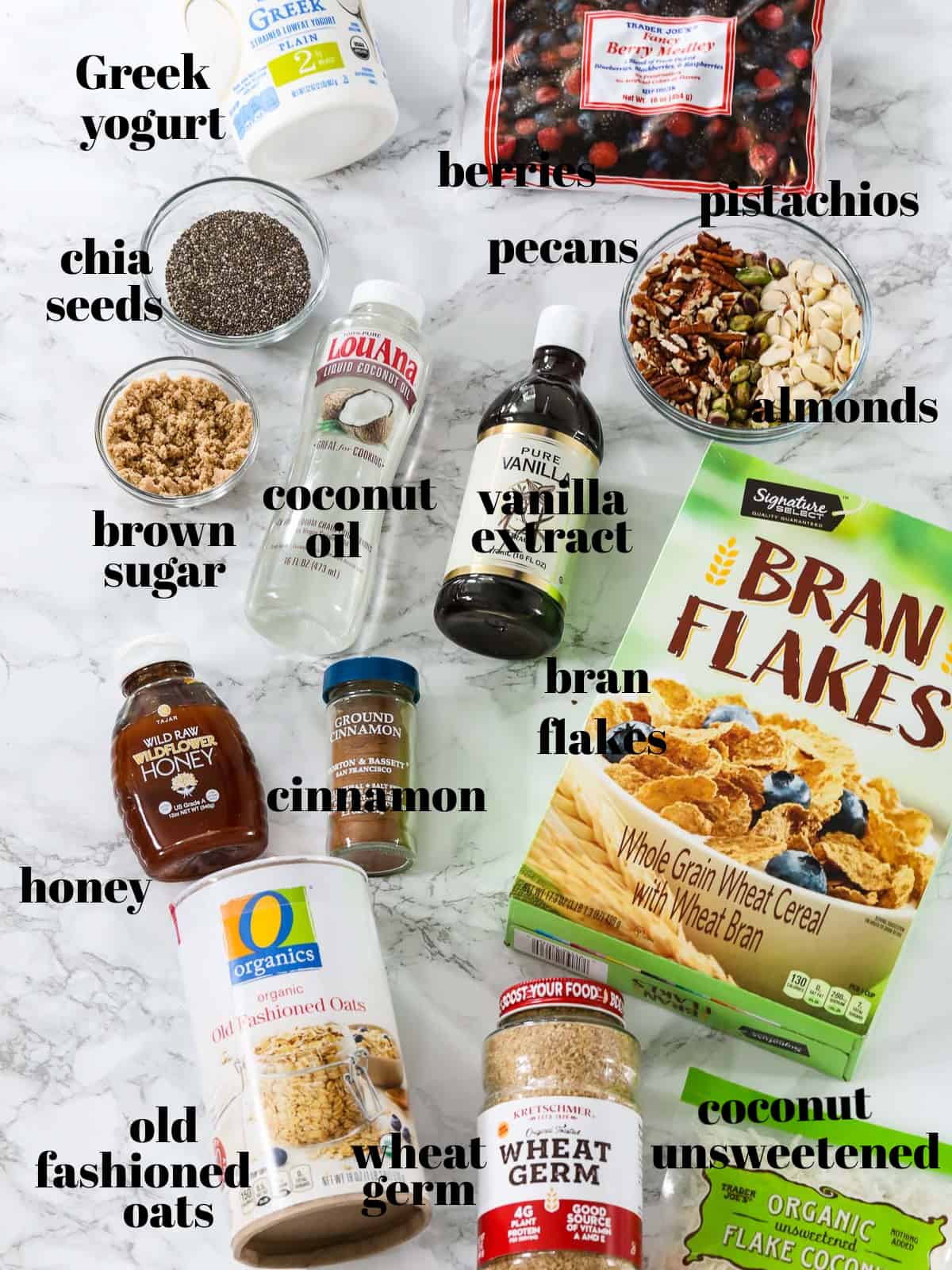 Ingredients labeled to make yogurt parfaits with a granola recipe on a table.