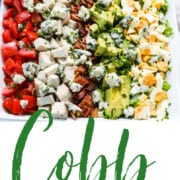 A graphic for Cobb Salad recipe showing the colorful salad in a square white dish.