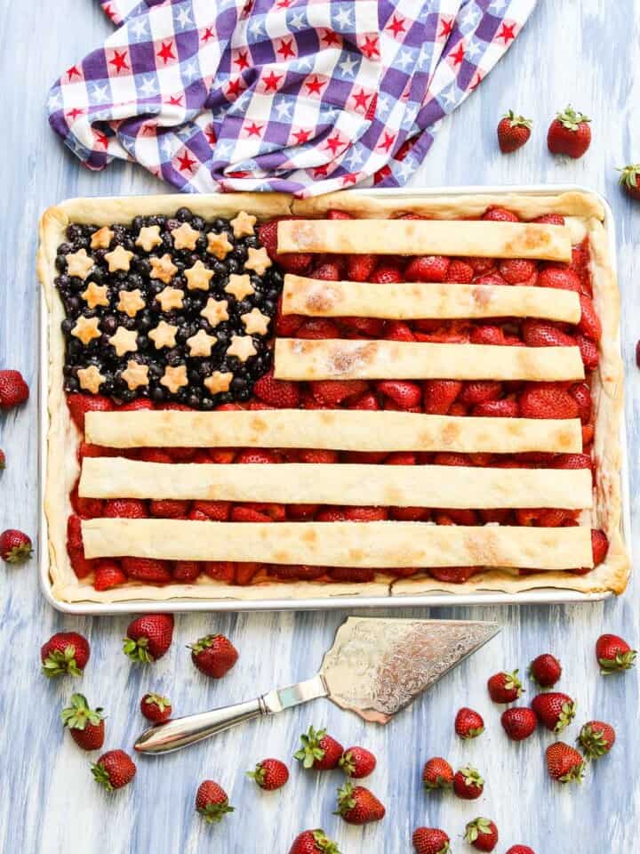 A sheet pan filled with a flag pie made with strawberries, blueberries, and pie crust.