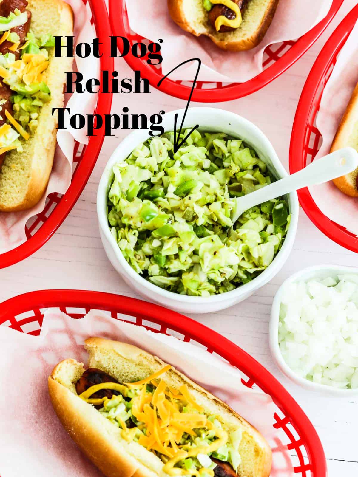 A white bowl filled with hot dog relish topping and red plastic baskets filled with grilled hot dogs.