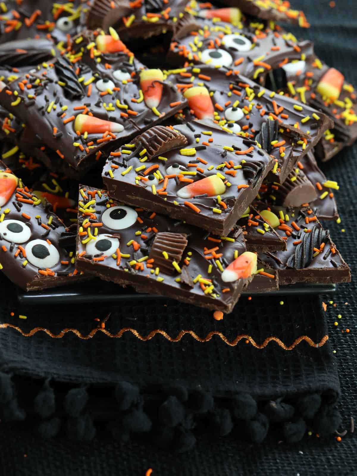 Halloween bark made from chocolate, candy, and sprinkles with candy eyeballs for a treat.