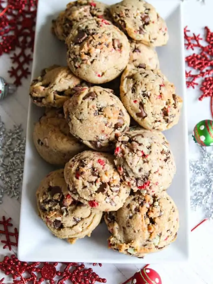 Looking down on a white platter piled with Chocolate Chip Peppermint Cookies.