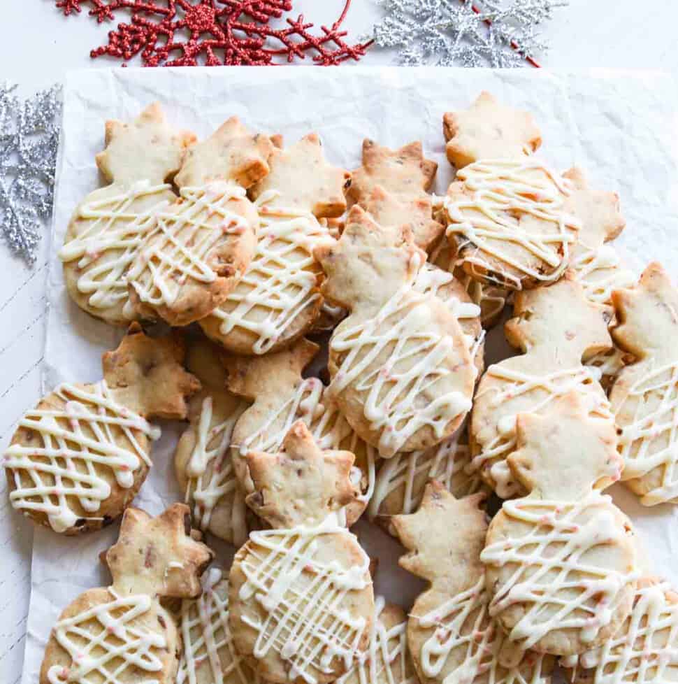 A pile of pineapple shaped peppermint macadamia nut shortbread cookies.