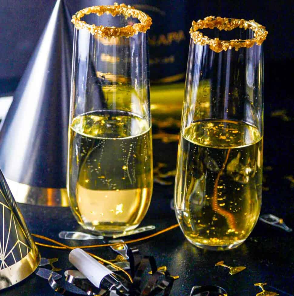 A New Years Eve party with champagne cocktails made with Goldschlager gold liquor.