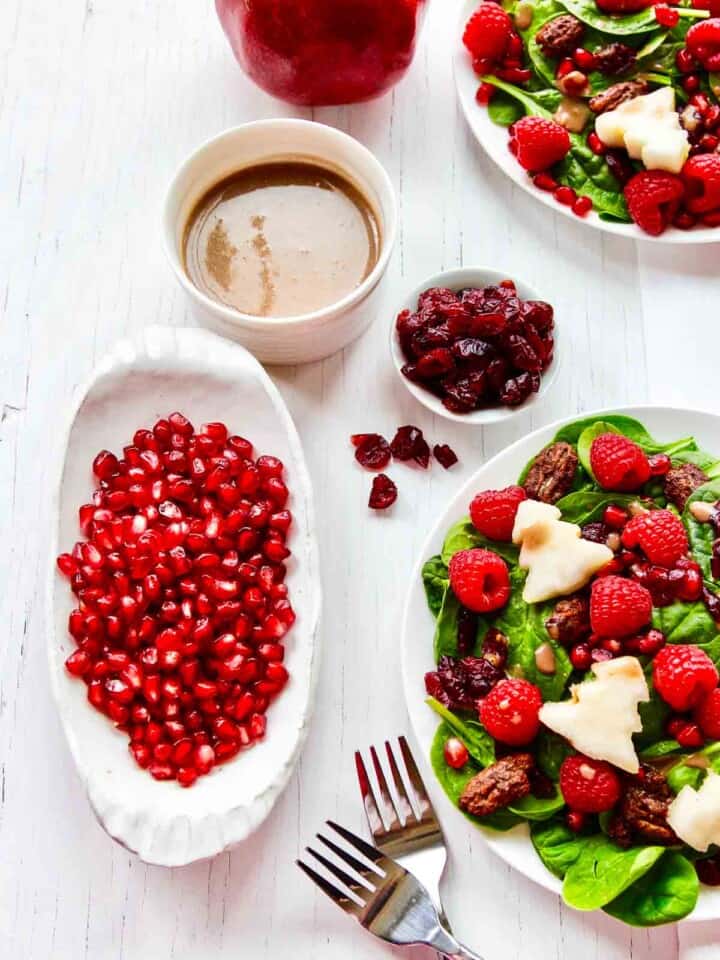 Christmas salad with white trees cut from pears drizzled with dressing.