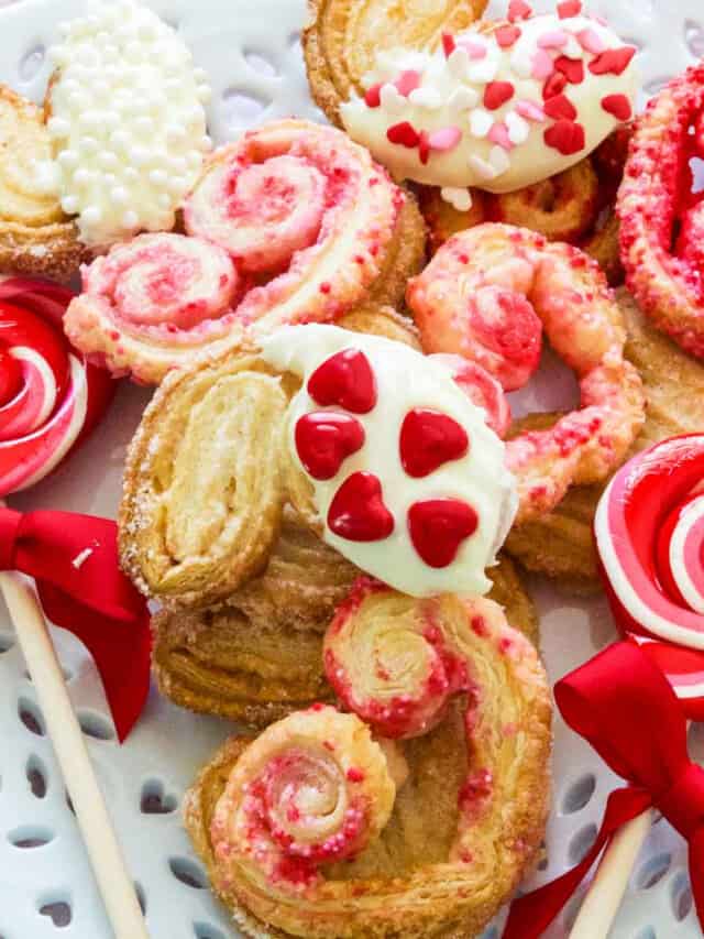 A white plate with heart shaped colorful Valentine cookies.
