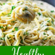 An ad for healthy alfredo sauce with a fork and twirled pasta.