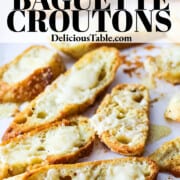 An ad for a parmesan baguette crouton recipe with them baked on a parchment lined baking sheet.