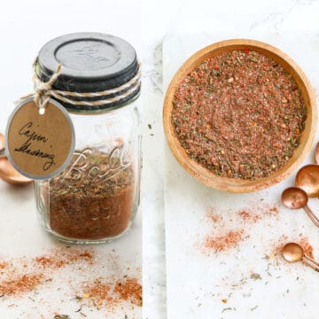 A small glass mason jar filled with Cajun seasoning with a label and it in a wooden bowl.