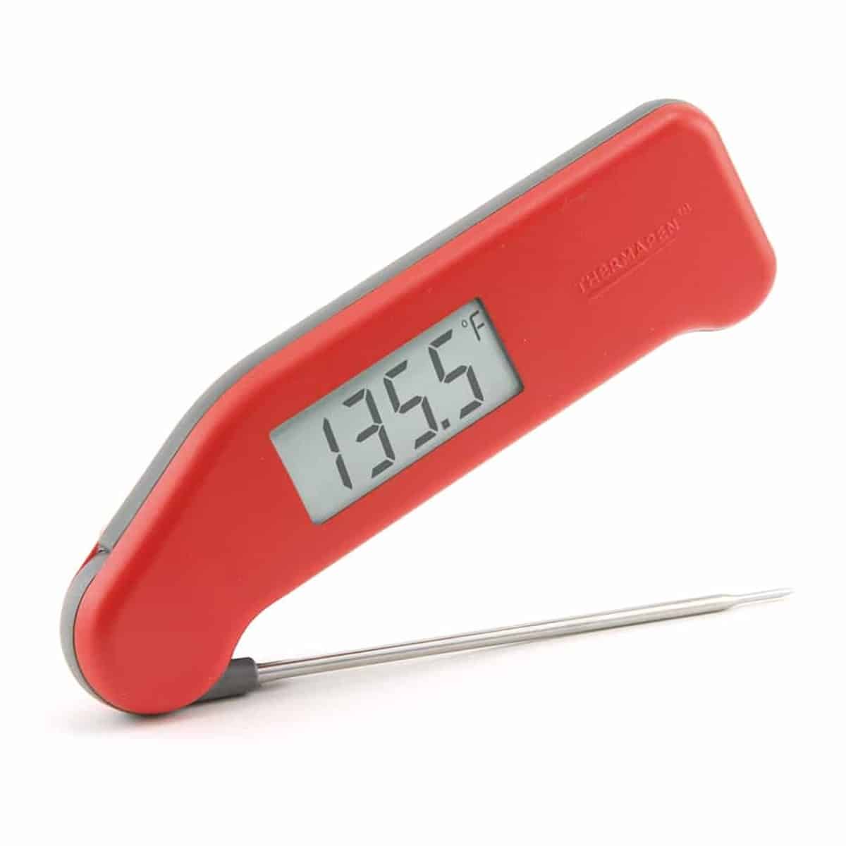 A red Thermoworks instant read thermometer.