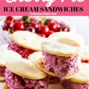 Cherry pie ice cream sandwiches on a white plate with bing cherries.