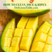 An orange tropical fruit cut open on a cutting board and sliced into cubes for a recipe.