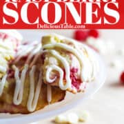 An ad for red raspberry scones on a white small cake platter drizzled with vanilla icing.