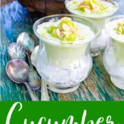 Chilled gazpacho cucumber soup topped with crab meat and grape garnish served in bowls over ice.