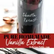 A glass flip top bottle filled with vanilla extract, and real vanilla bean pods on the table.