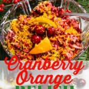 A cranberry relish in a clear crystal bowl on a Christmas buffet table.