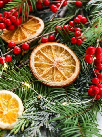 Showing how to make homemade dried orange slices on a sheet pan for holiday decorations.