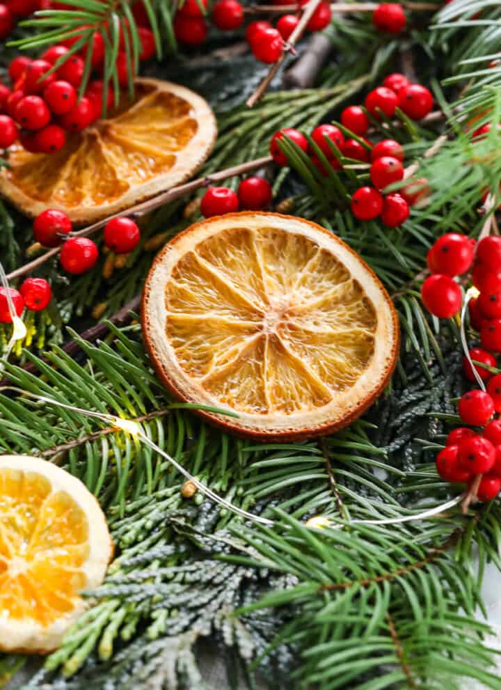Showing how to make homemade dried orange slices on a sheet pan for holiday decorations.