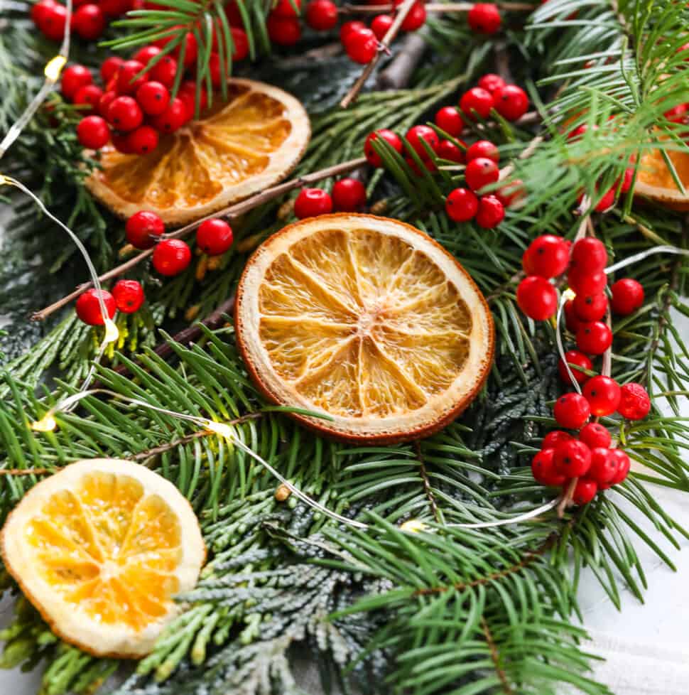 Showing how to make homemade dried orange slices on a sheet pan for holiday decorations.