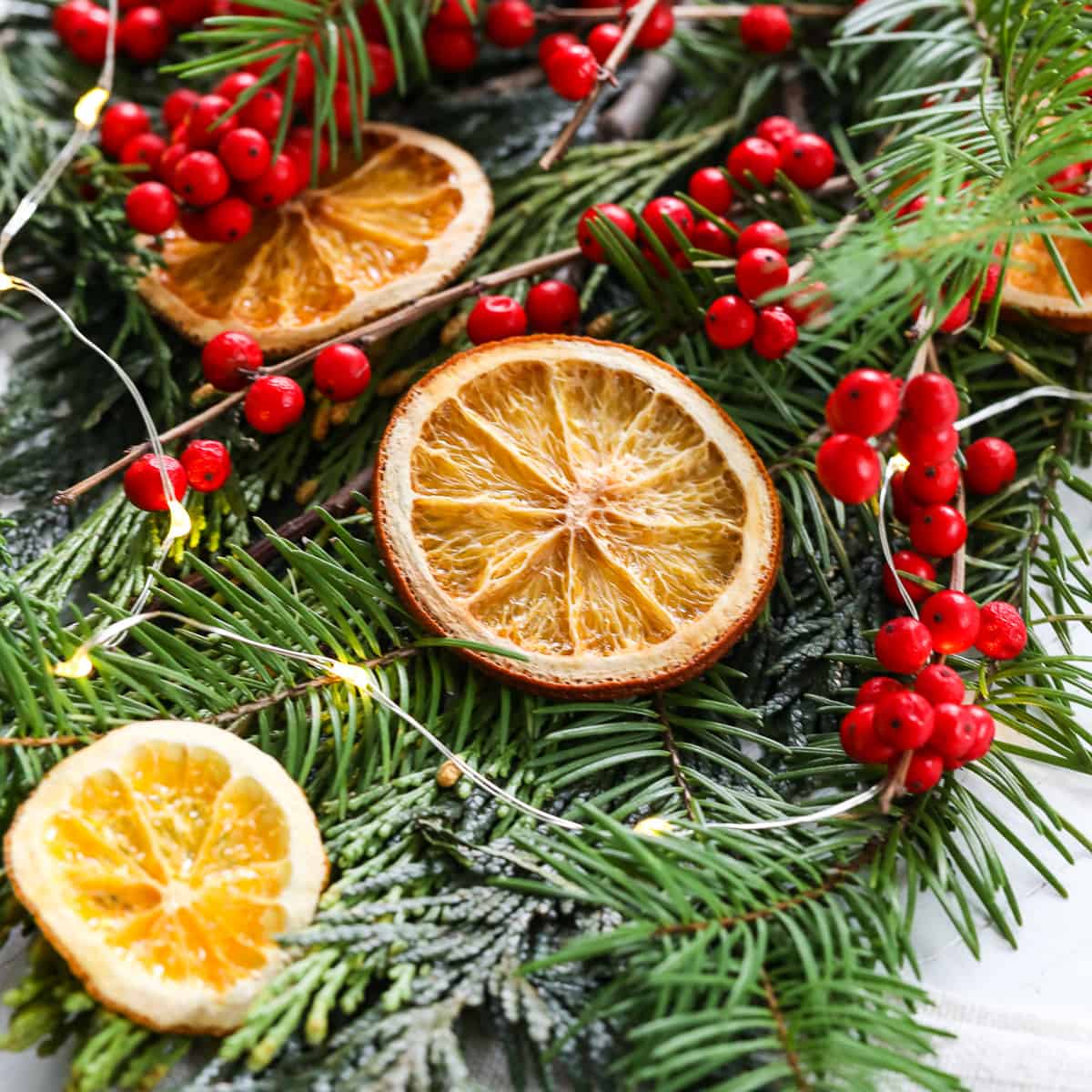 Showing how to make homemade dried orange slices on a sheet pan for holiday decorations.