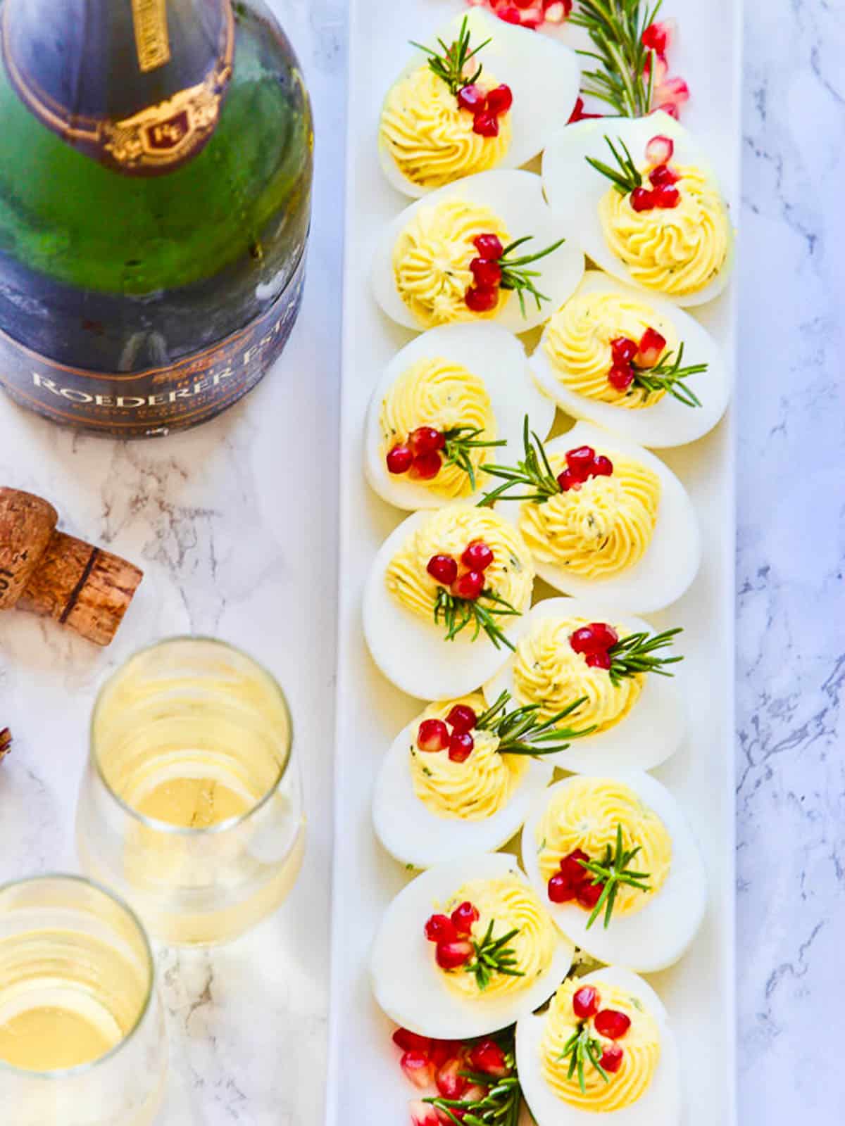 https://www.delicioustable.com/wp-content/uploads/2022/12/Holiday-Deviled-Eggs-with-champagne-copy.jpg