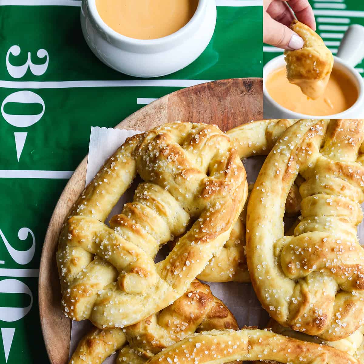 A wood platter loaded with soft pretzels shaped like footballs and beer cheese dip in a bowl nearby.