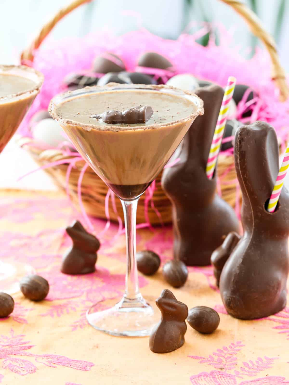 A chocolate martini on an Easter table with chocolate bunnies filled with cocktails.