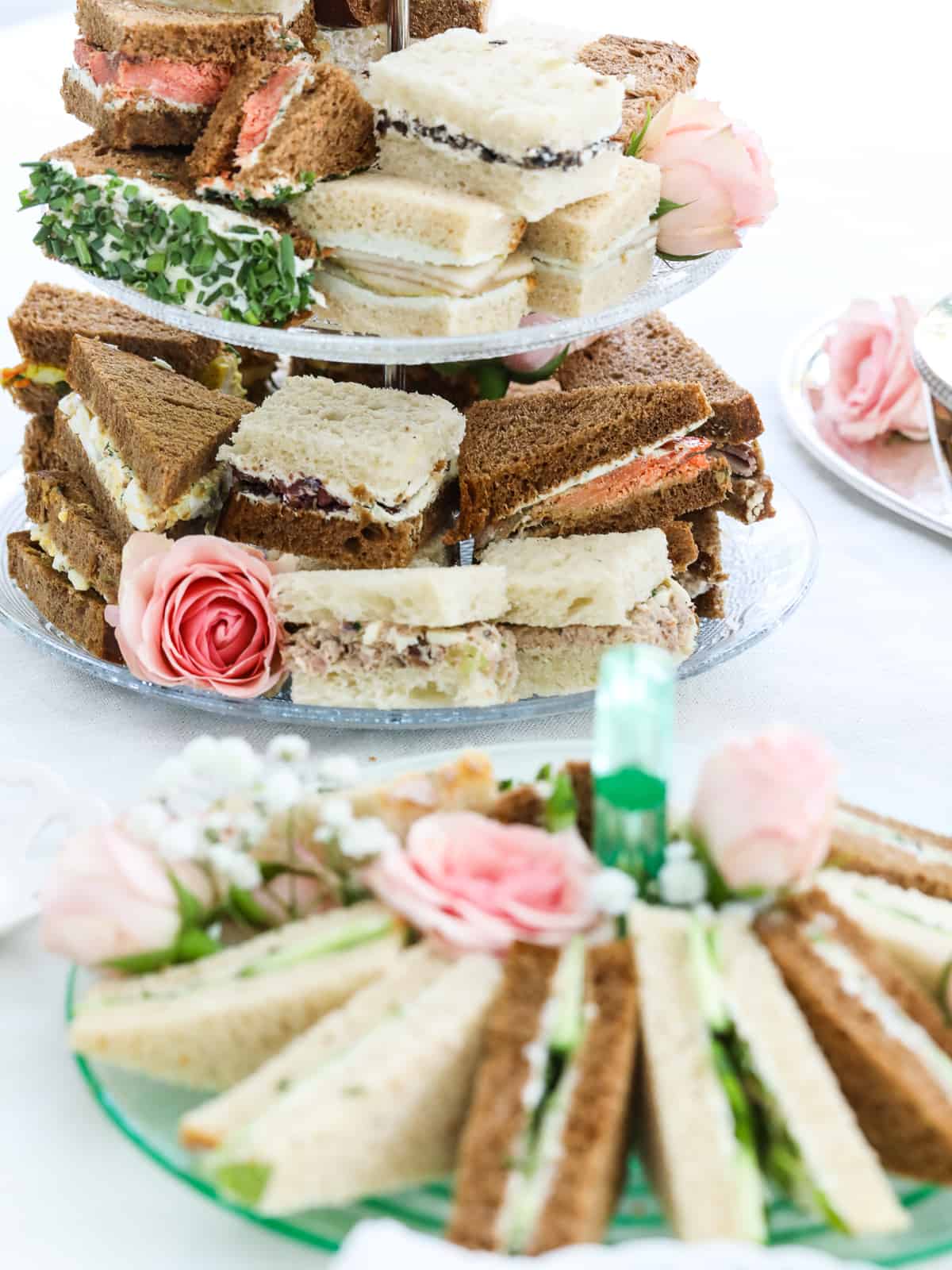 Two trays of handmade tea sandwiches ready for afternoon tea.