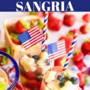 Two glasses of white sangria and how to make this summer drink recipe to serve at a cookout or for patriotic holidays.
