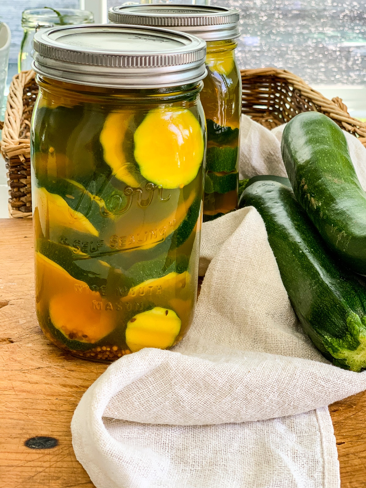 Two jars of pickles made from zucchini squash. 