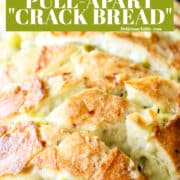 A loaf of sliced bread filled with a cheesy mixture to make a pull apart crack bread recipe.