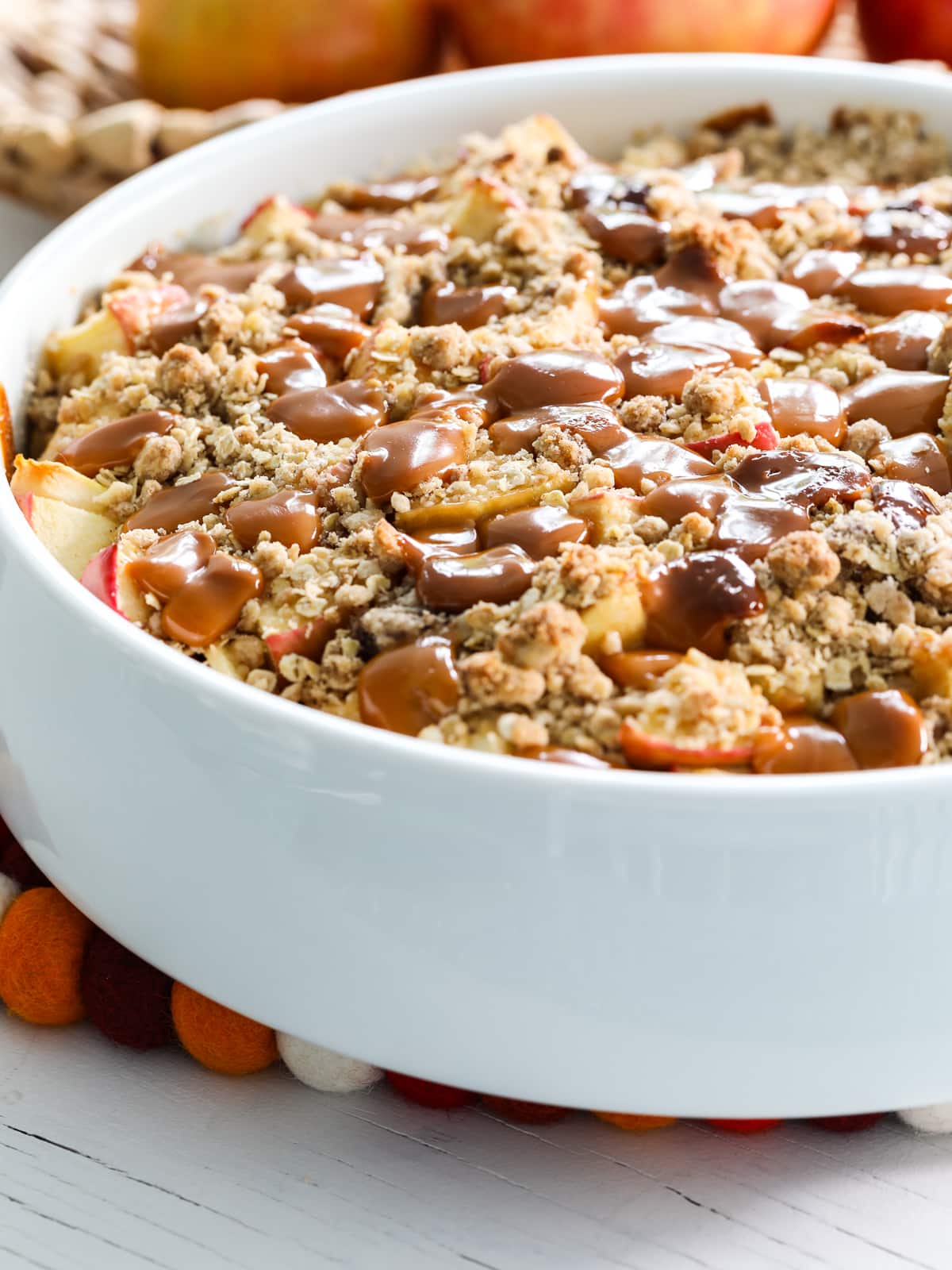 Close up of a caramel apple crisp baked in a dish.