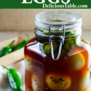 Deli-Style Pickled Egg Recipe in a tall glass jar with a clamp lid.